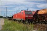 DB Schenker 185 046-0 mit leeren Autotransportwagen am 24.07.2012 in Nuthetal-Saarmund